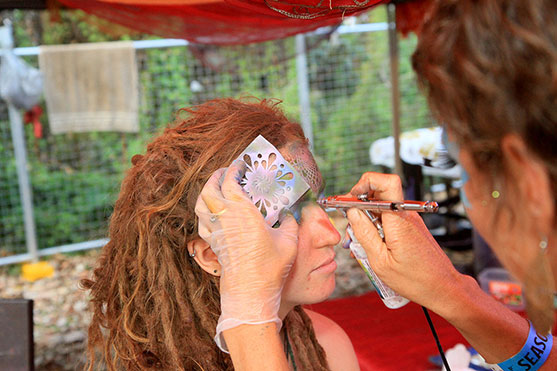 Cerise hard at work getting her face painted