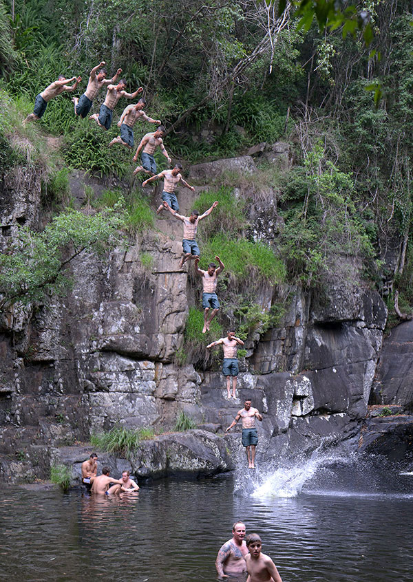 Jumping from rocks at Cedar Creek Falls