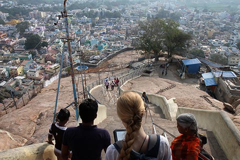 Bronwen reading Lonely Planet on her Kindle while climbing down from the Rock Fort, Tiruchirappalli