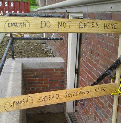 English: Do Not Enter Here; Spanish: Entero Somewhere Elso
