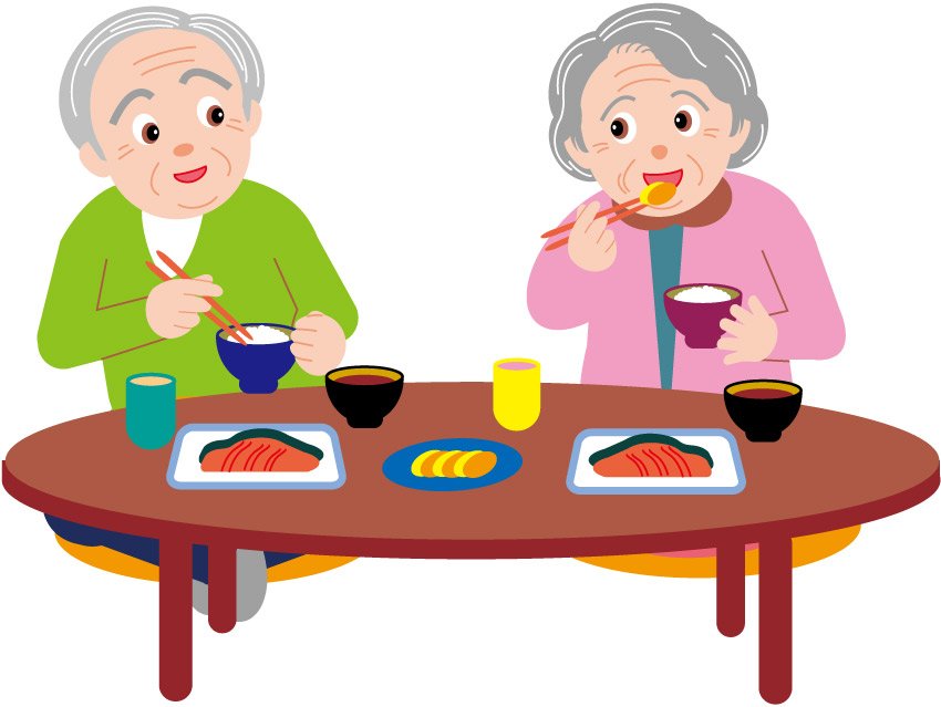 Elderly couple eating dinner