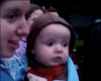 A baby sees fireworks for the first time.