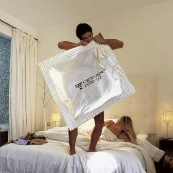 Man with a very large condom