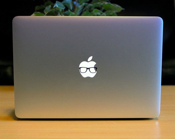 Macbook Pro with glasses sticker