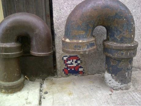 Mario emerging from a drainpipe.
