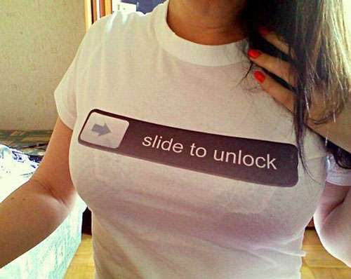 A woman wearing a shirt: Slide to Unlock