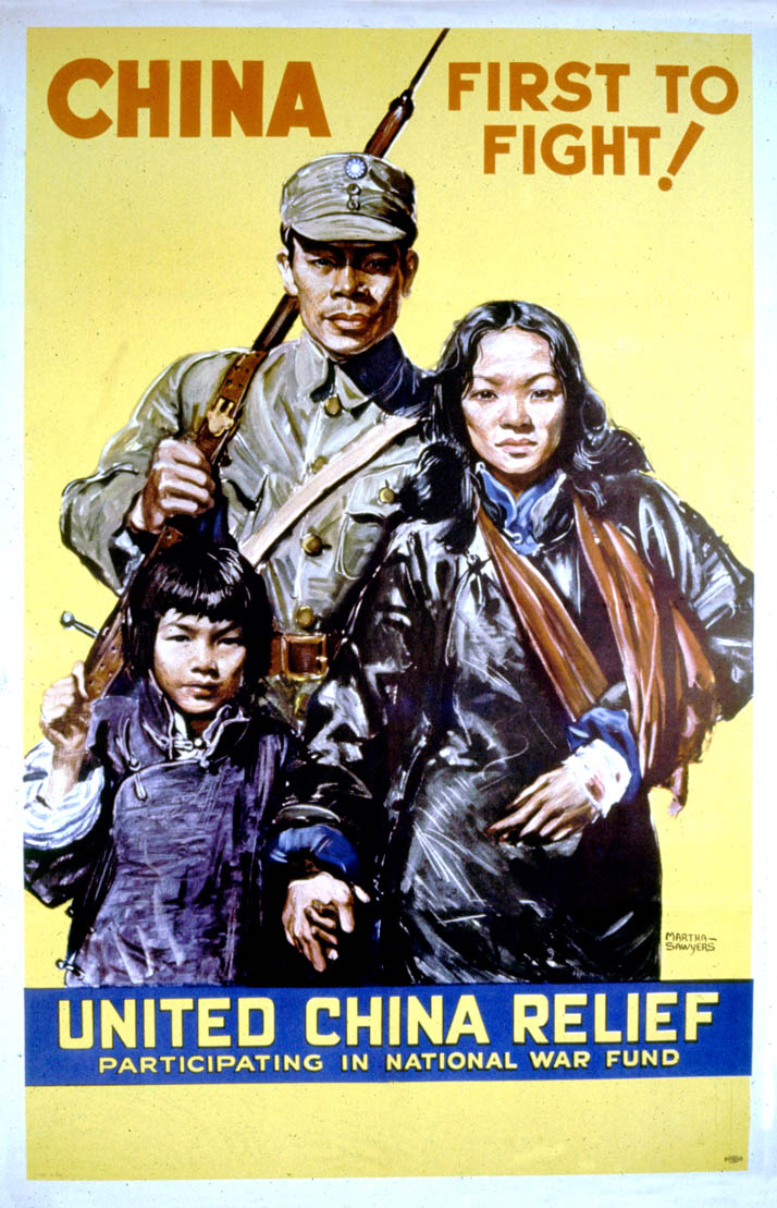 A Chinese soldier stands with his family