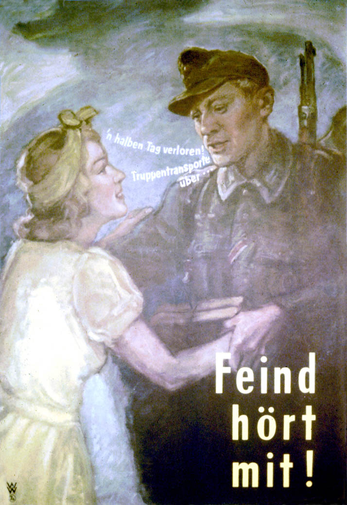 A German soldier speaks to a young woman
