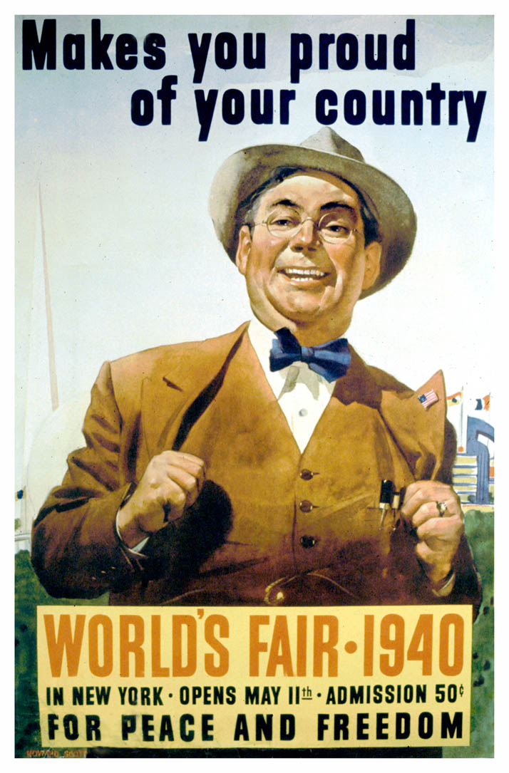 A smiling man in a vested suit stands with his thumbs in his vest