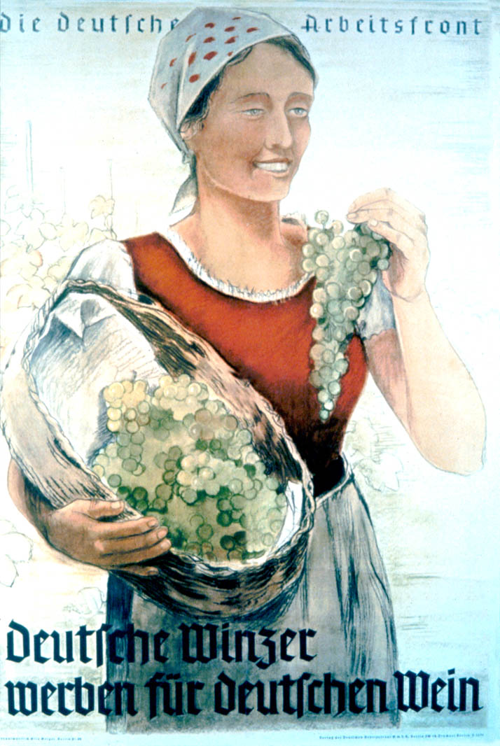 A smiling woman is pictured carrying grapes