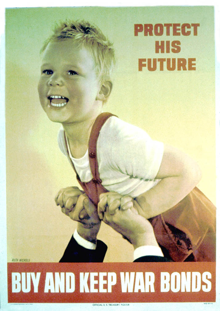 A smiling young boy is held aloft