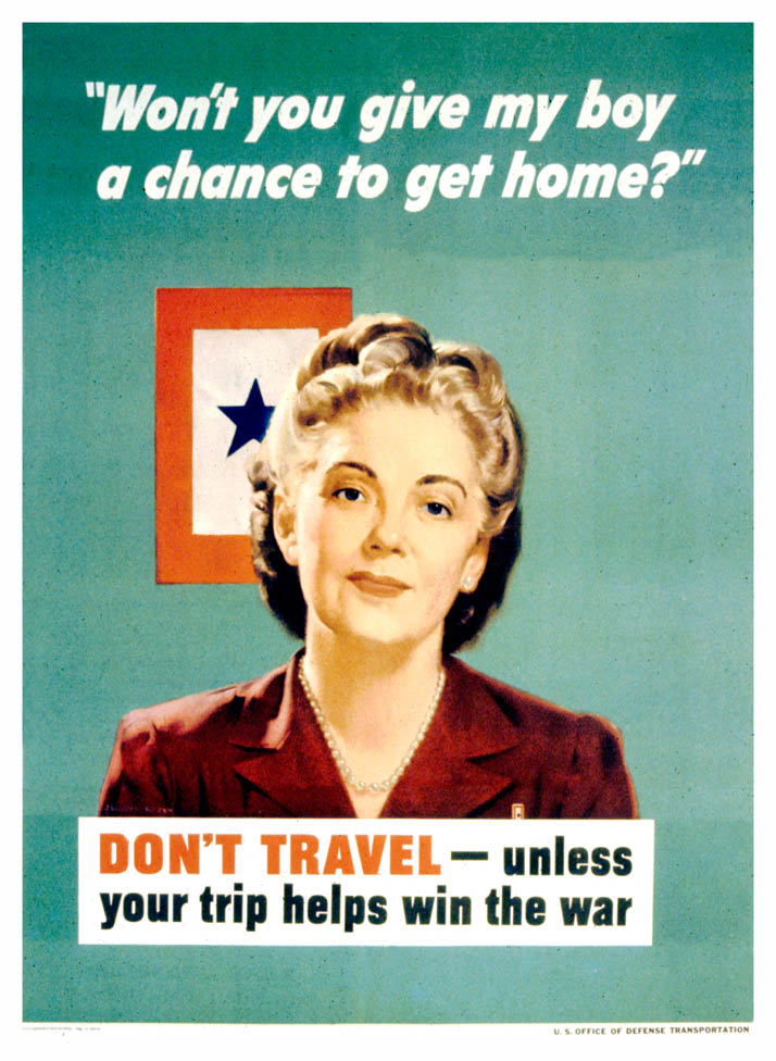 A women stands before a blue star service flag